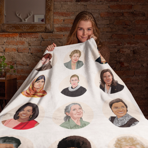 a woman holding a blanket with a bunch of people on it